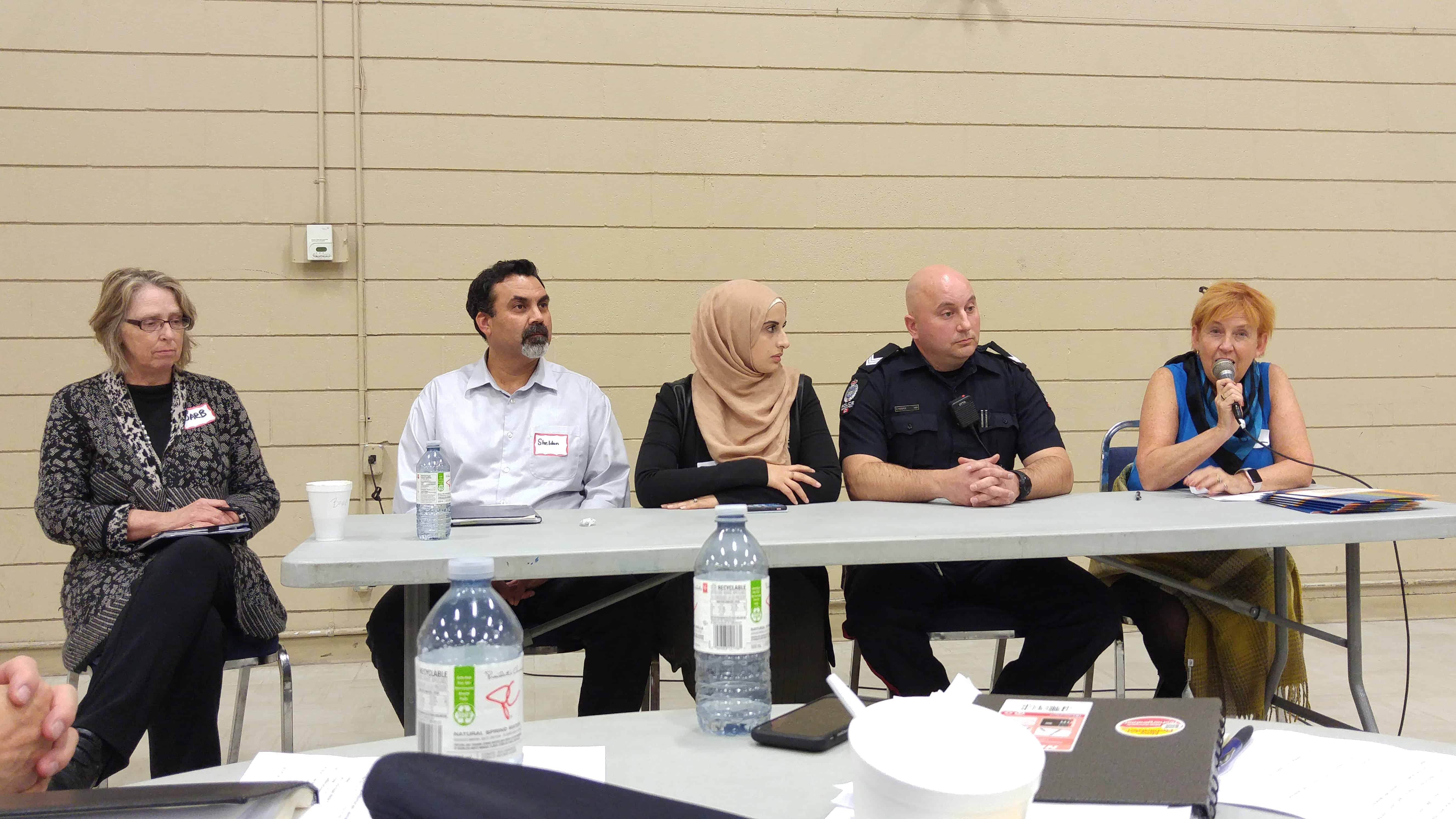 From left to right: Barbara Ursuliak, Sheldon Hughes, Fatmeh Kalouti, Sgt. Curtis Hoople, and Jan Fox talk about collaborative safety initiatives during the neighbourhood safety panel discussion.| Hamdi Issawi