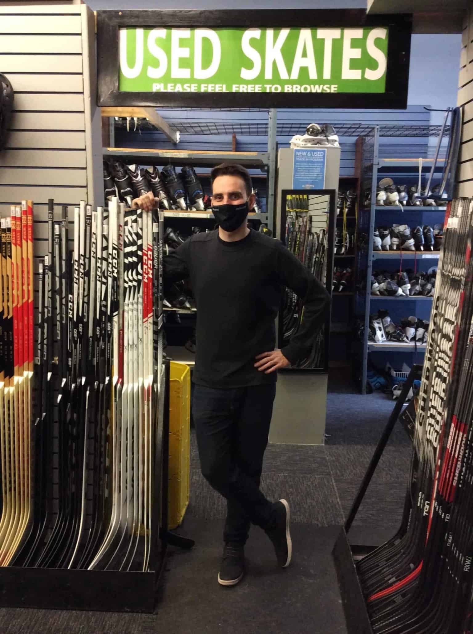 Tyler Schmidt, purchaser and sales manager, at the entrance to the used skates room at Allsports & Cycle. | Constance Brissenden