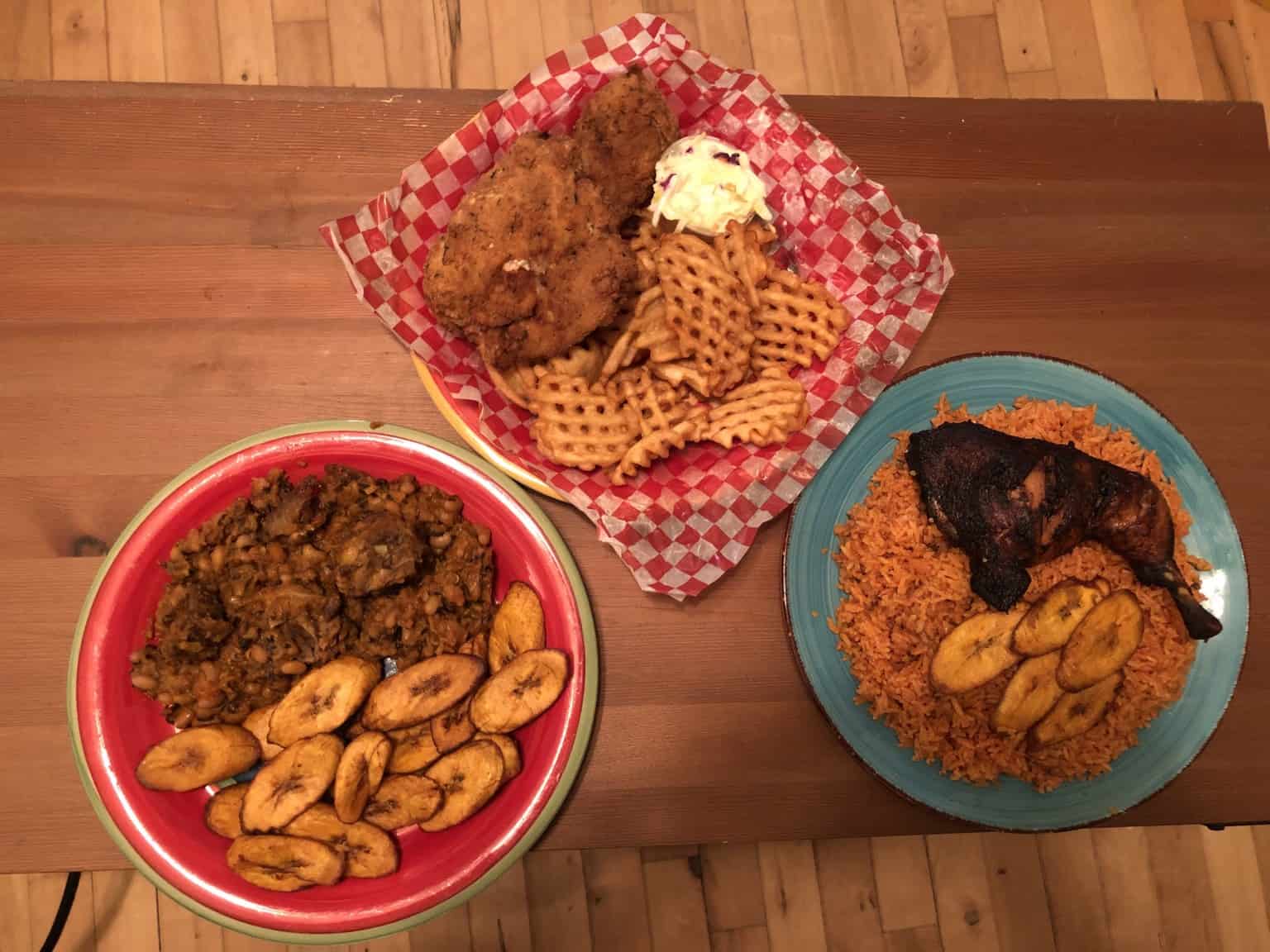 A sample of food from Selasi’s Grill. From left to right: beans and plantains with goat, Annie’s fried chicken, and jollof rice with chicken. | Stephen Strand